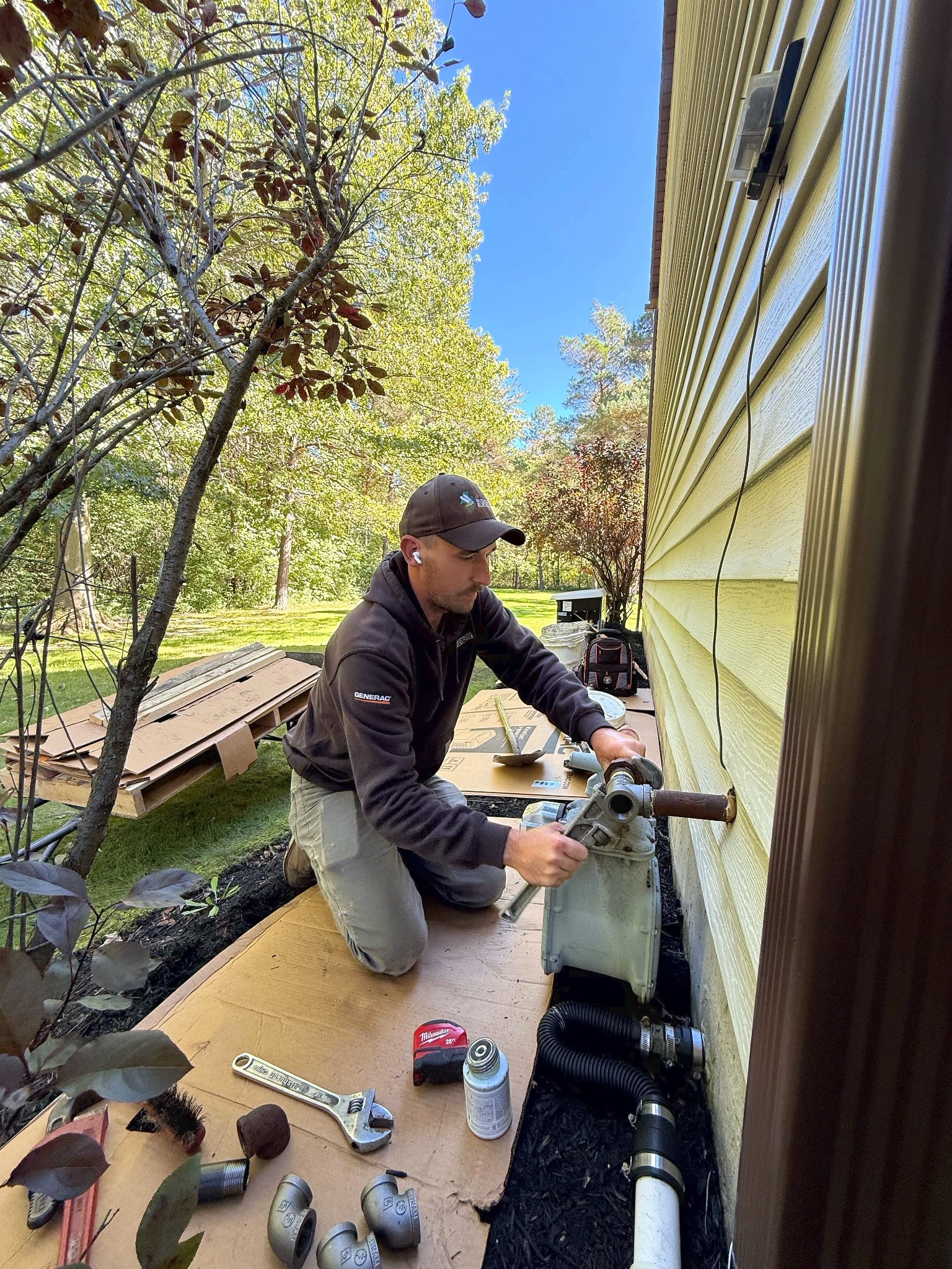 Tyler working on a fuel connection at a Buzyniski Electric installation