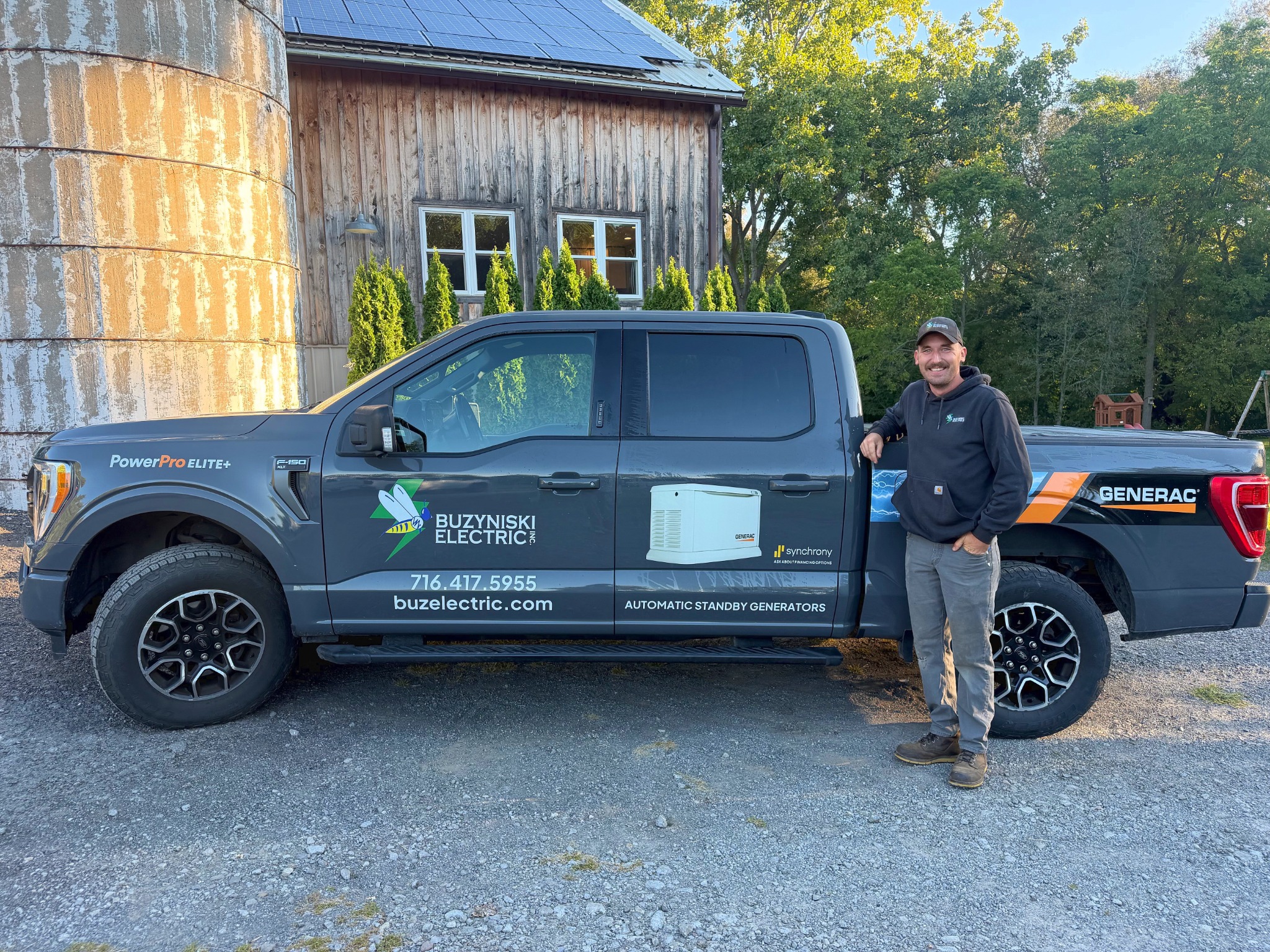 Tyler beside the Buzyniski Electric service truck